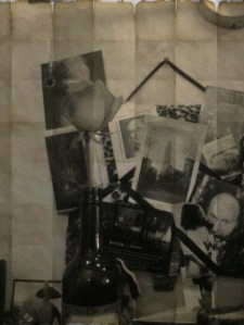 The rose is at home on a crowded shelf above my desk. The rose is at home on a crowded shelf above my desk.